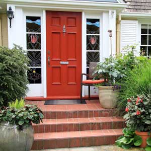 picture of Pre-purchase house porch with a red door and lots of plants